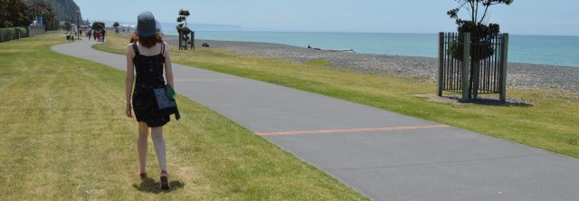 The author stands next to a path by the sea. The path continues off into the distance.