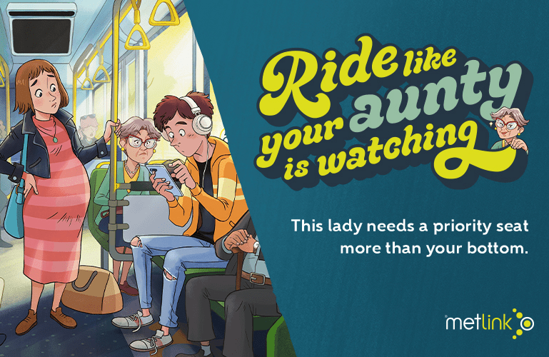 A cartoon depicting a young man wearing headphones, using his cell phone sitting on a green seat next to a man with a cane. An older woman is glaring at the young man from her green seat while a pregnant woman is standing stares at the young man. Text says: "Ride like your aunty is watching. This lady needs a priority seat more than your bottom".